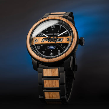 Wooden watch with black face and Ford logo on a gradient blue background