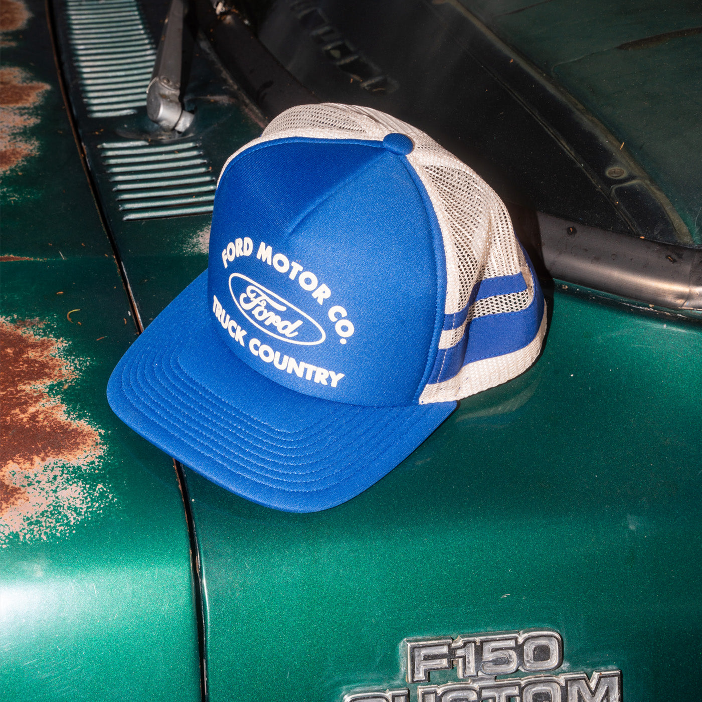 blue ford moto co truck country hat sitting on ford f-150 phantom