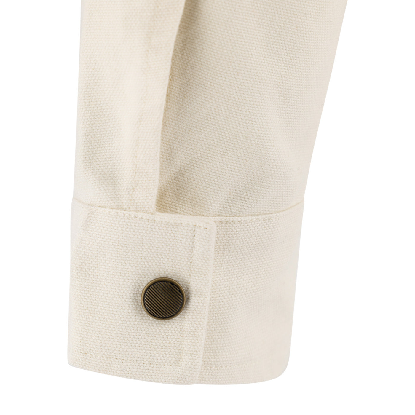 Close-up of a beige buttoned shirt sleeve with a button on a white background
