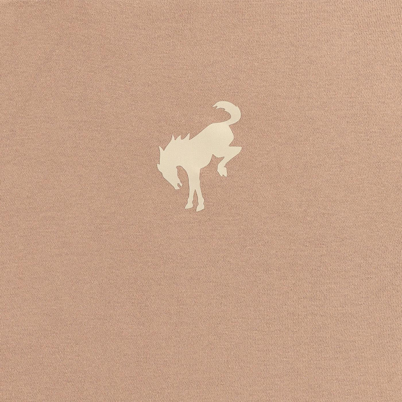 Silhouette of a ford bronco horse on a textured beige background