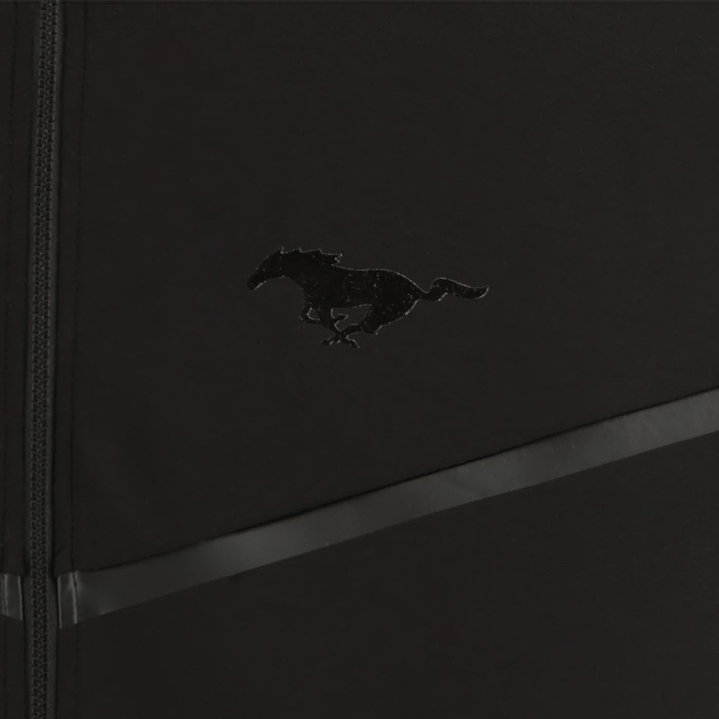 Black leather-bound book with a mustang horse emblem on a dark background