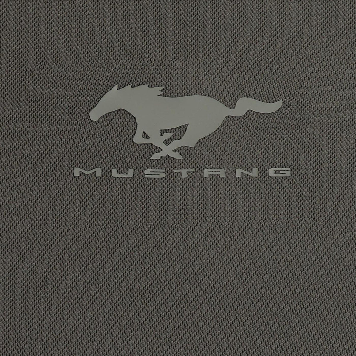 A close-up of a dark gray textured fabric featuring the embossed silver Mustang logo and the word 'MUSTANG' underneath.