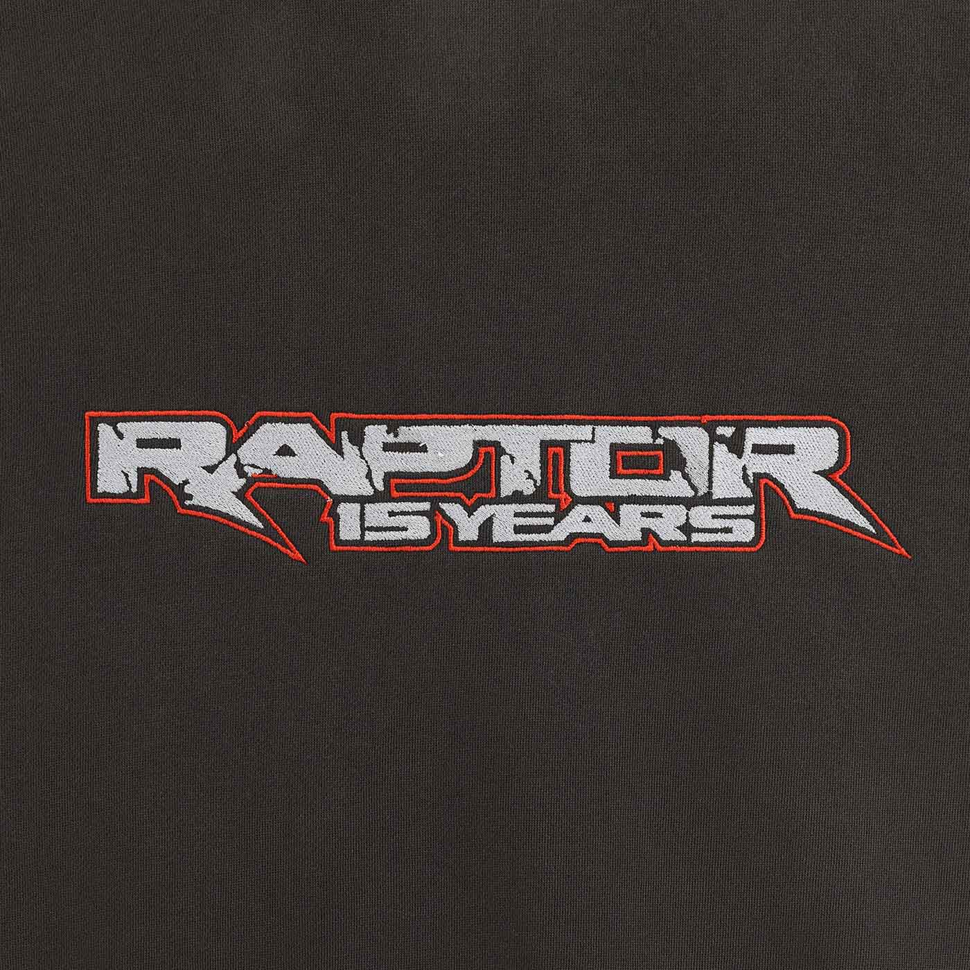 Embroidered 'Raptor 15 Years' logo on a black background