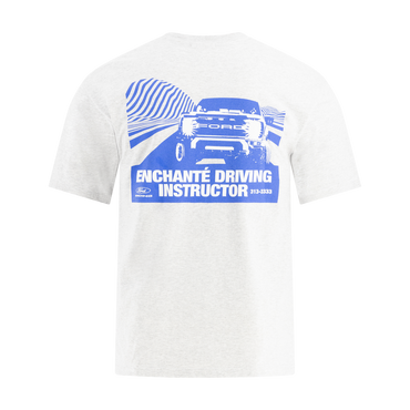 White t-shirt with blue graphic and text Enchante driving instructor on a white background
