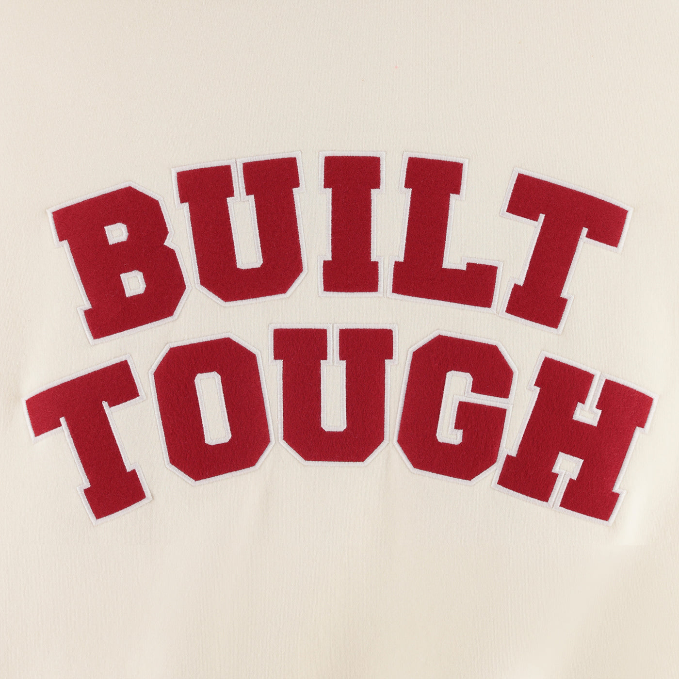 Red text 'BUILT TOUGH' on a beige background