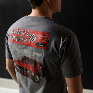 Person wearing a t-shirt with a graphic design on the back, featuring the text 'BOSS 429' and a car illustration.