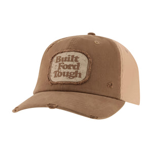 A distressed brown baseball cap with a front patch reading 'Built Ford Tough' in brown lettering on a cream background. The cap features a curved brim with intentional frayed distressing on the edges and a two-tone brown front panel.