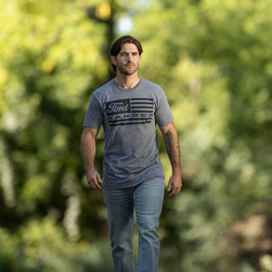 man wearing a Ford ranger american flag graphic gray t-shirt walking outside