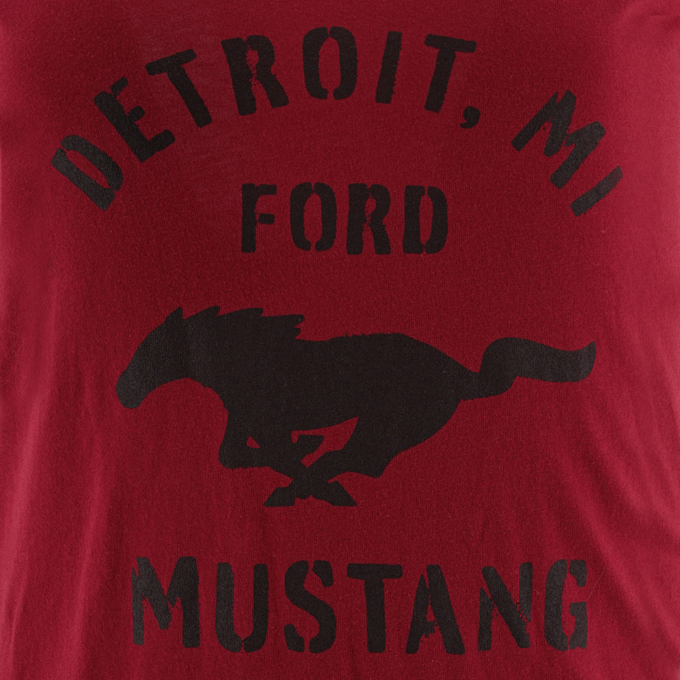 Red t-shirt with black text and horse graphic on a red background