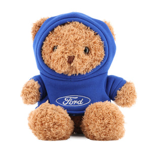 Plush teddy bear wearing a blue hoodie with Ford logo on a white background