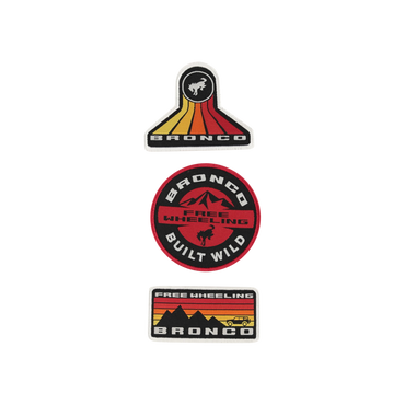 A set of three Ford Bronco patches with varying designs, mounted on a display card. The patches feature the Bronco logo and the phrases 'Built Wild' and 'Free Wheeling'.