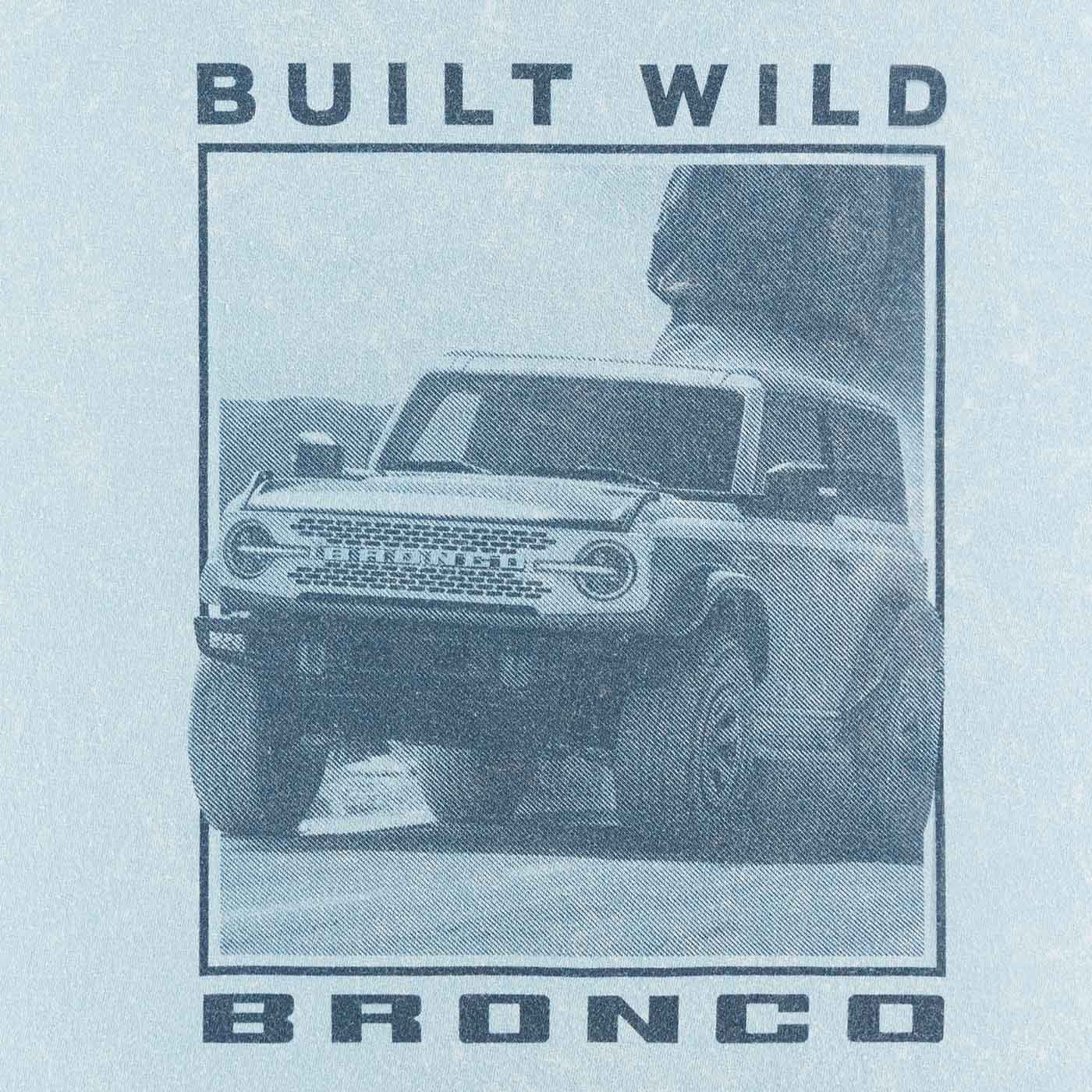 close up of Built Wild Bronco of Bronco vehicle off-roading in desert on blue background