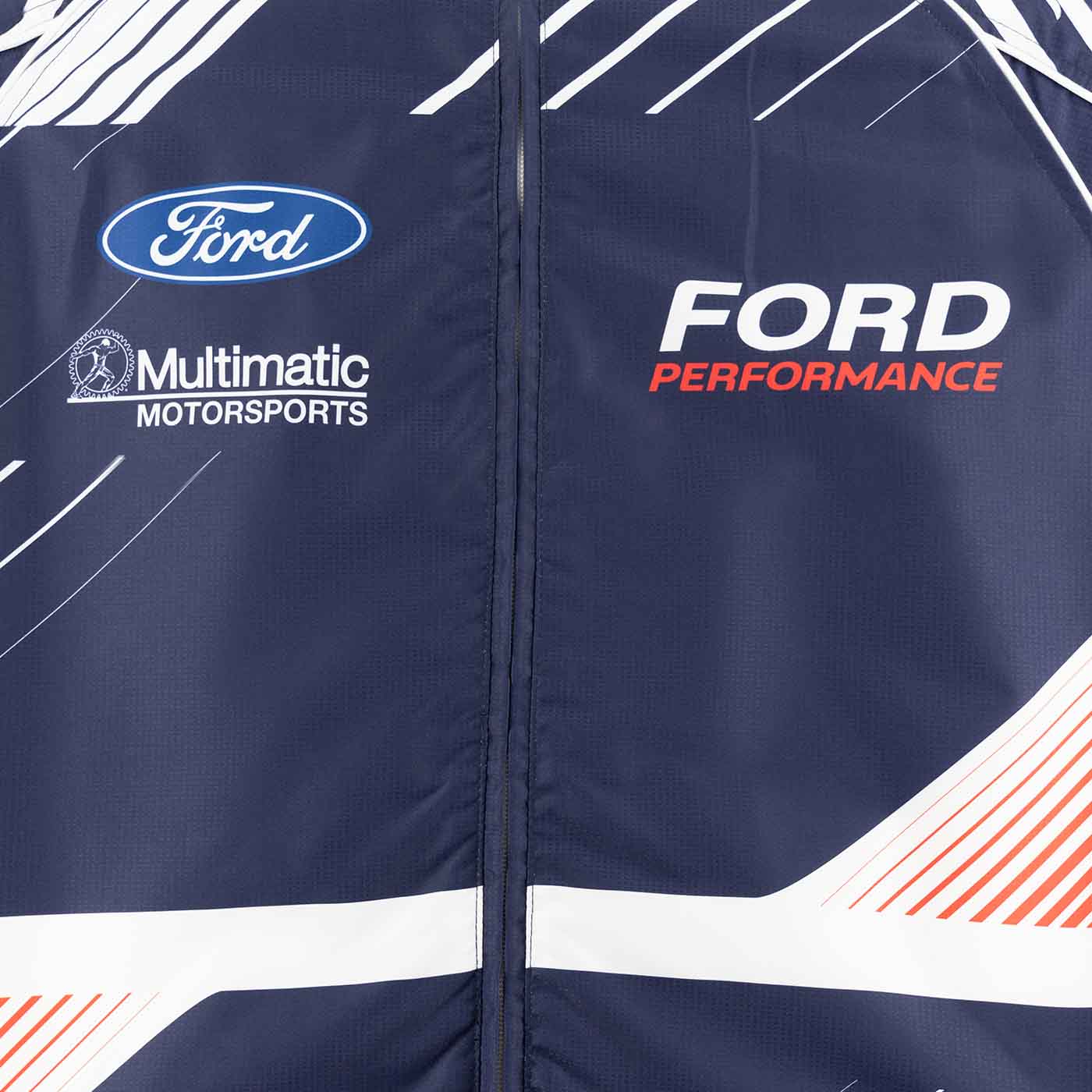 close up of ford performance jacket with blue ford oval, Multimatic Motorsports, and Ford Performance emblems.