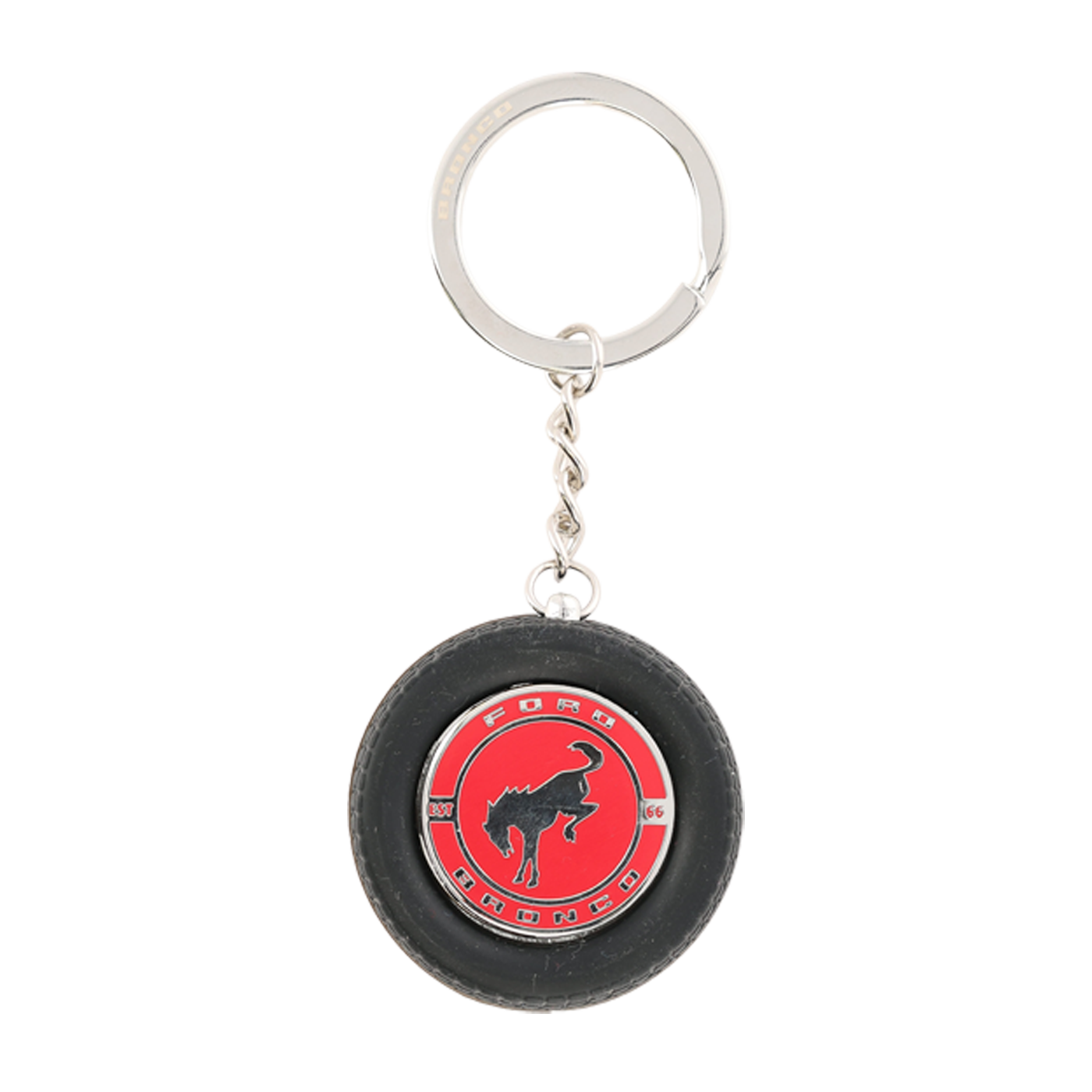 Keychain in the shape of a small tire with a red center and logo on a white background