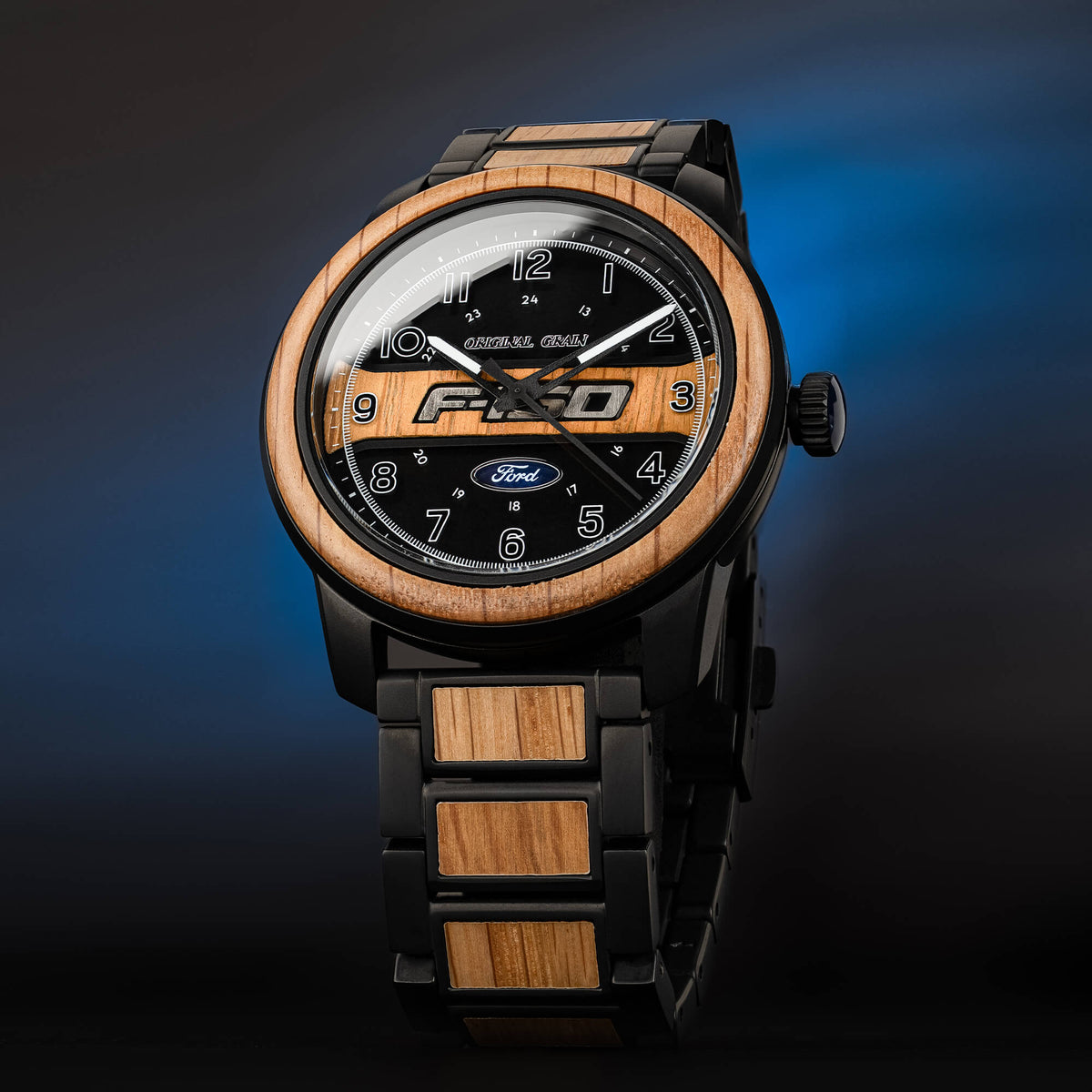 Wooden watch with black face and Ford logo on a gradient blue background