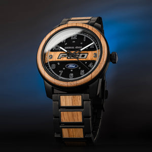 Wooden watch with black face and Ford logo on a gradient blue background