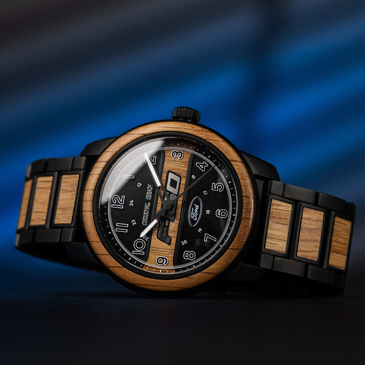 Wooden and black watch with a blurred blue background