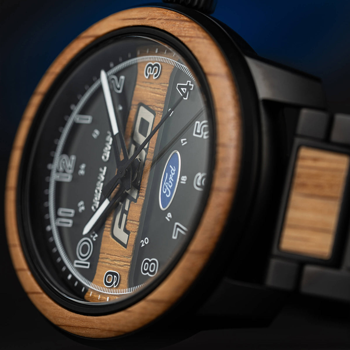 Wooden watch with black face and Ford logo on a dark background
