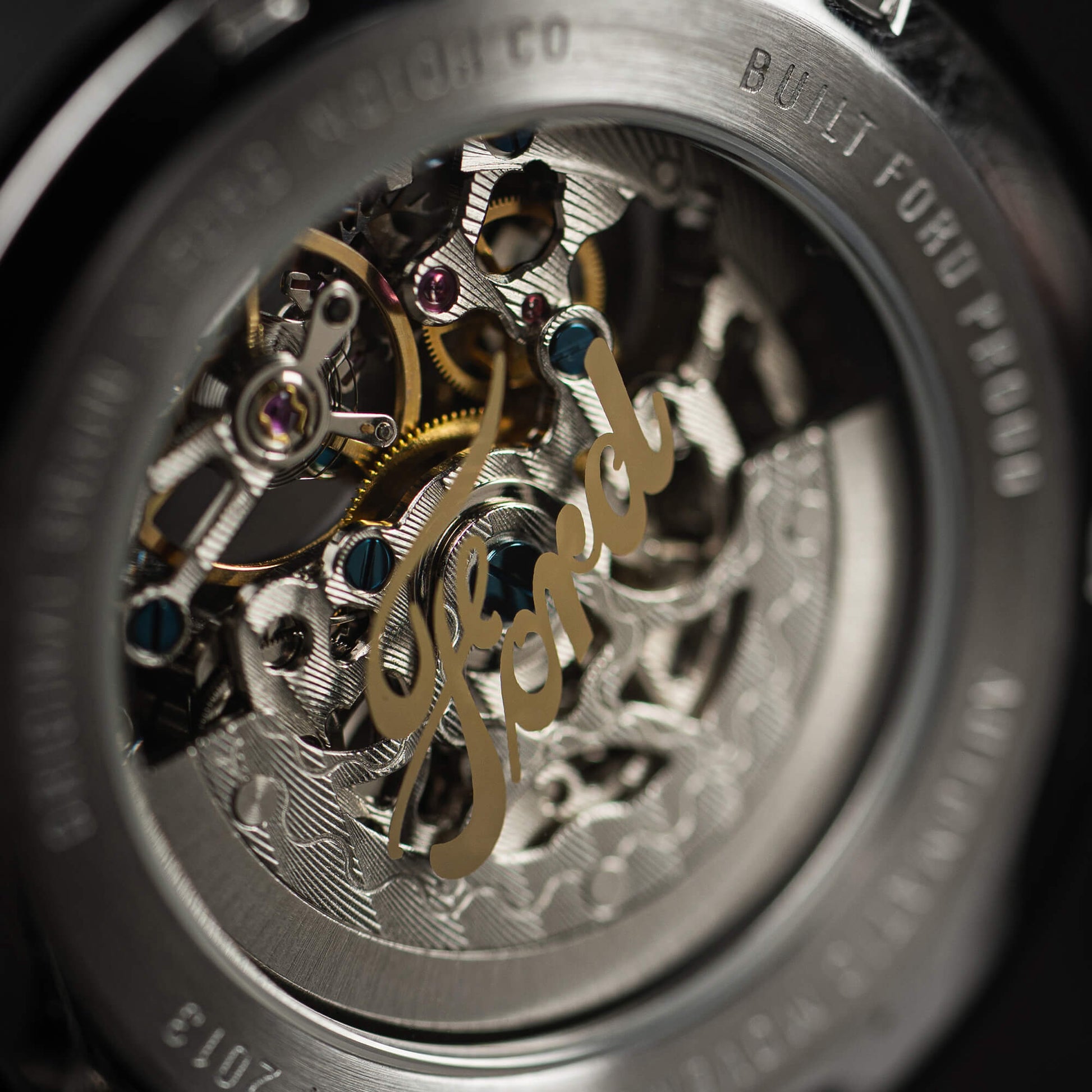 Close-up of a watch mechanism with 'Ford branding