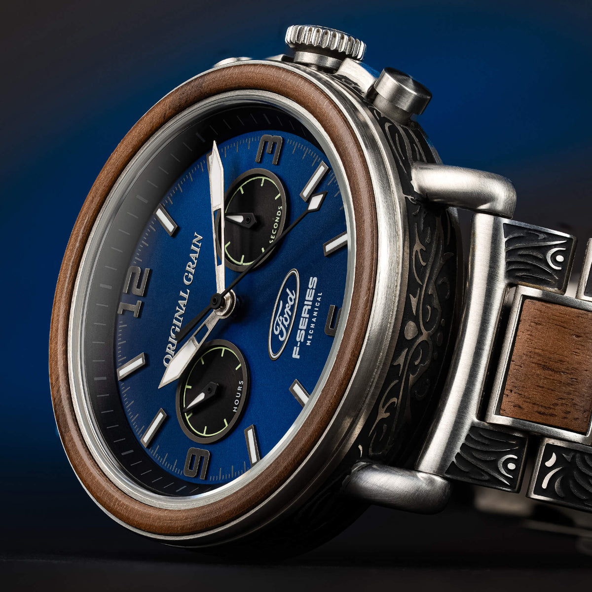 Luxury watch with blue dial and wooden accents on a dark background