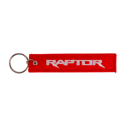 Red keychain with 'Raptor' text on a white background