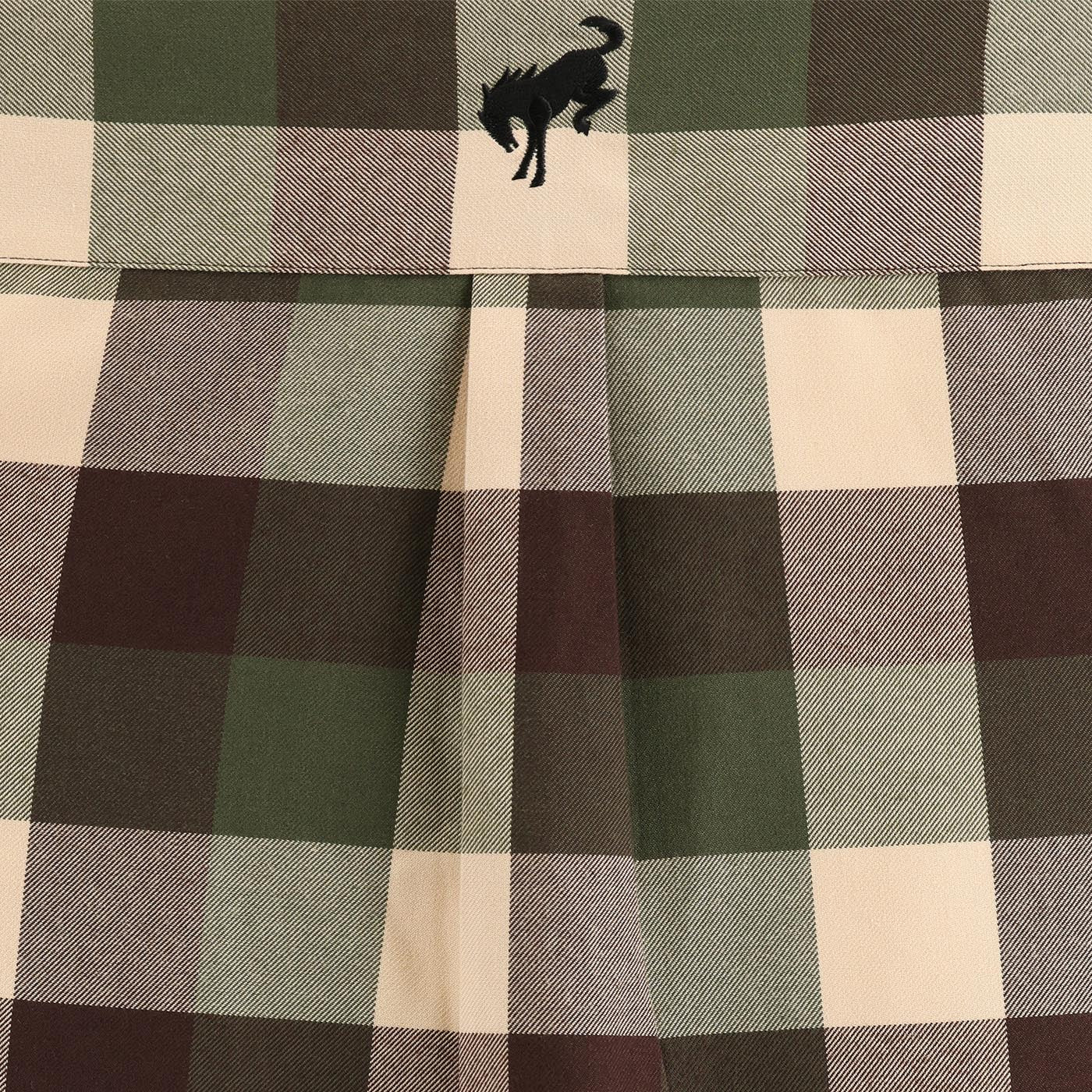 Plaid fabric with a wolf logo in the corner