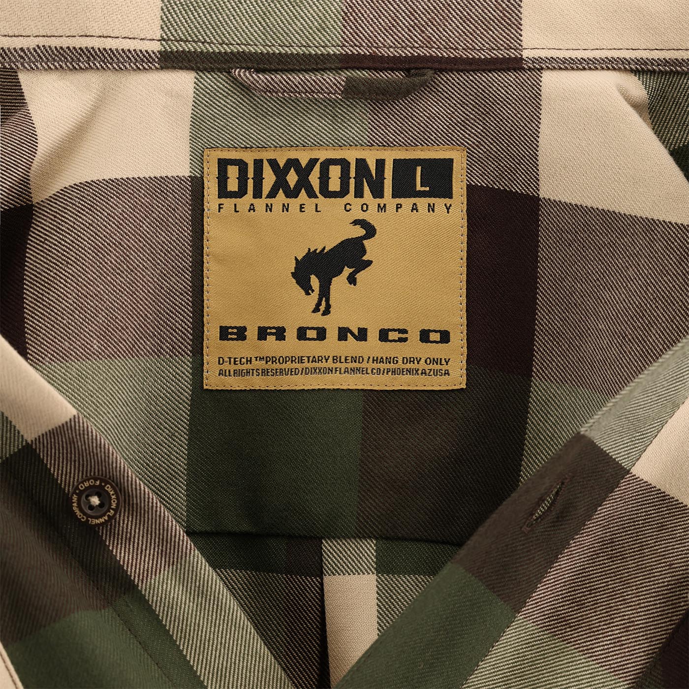 Dixon Flannel Company label on a plaid fabric background