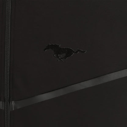 Black leather-bound book with a mustang horse emblem on a dark background