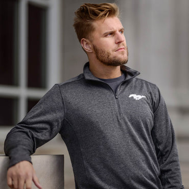 blonde man looking into the distance with gray quarter zip mustang sweatshirt with collar