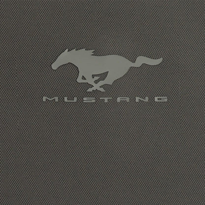 A close-up of a dark gray textured fabric featuring the embossed silver Mustang logo and the word 'MUSTANG' underneath.