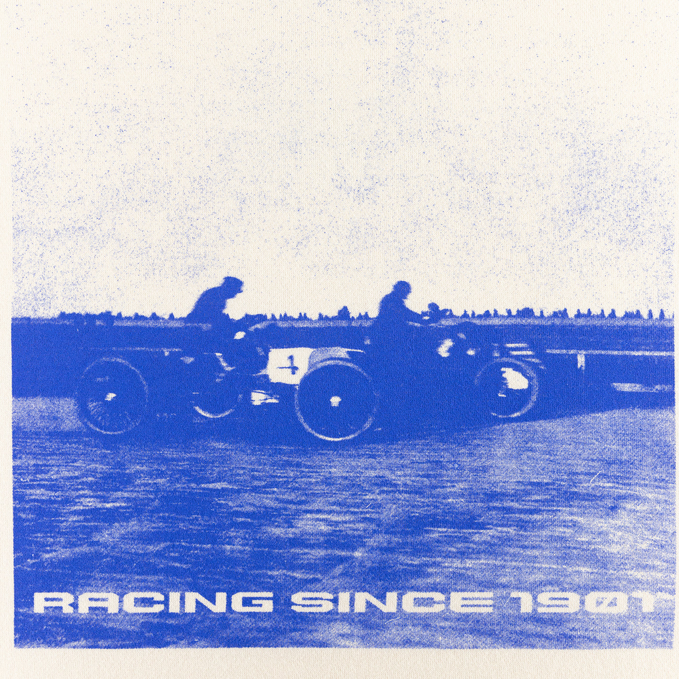 Vintage-style illustration of two people on a motorcycle with 'Racing Since 1901' text.