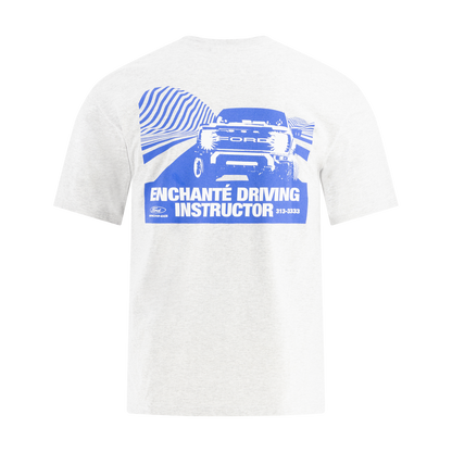 White t-shirt with blue graphic and text Enchante driving instructor on a white background