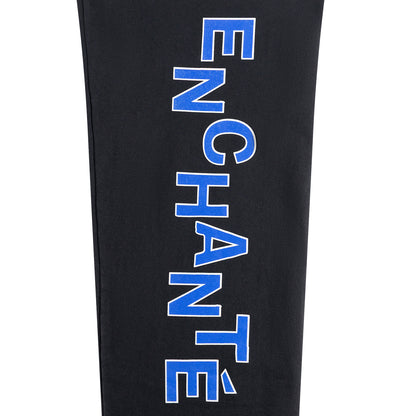 Black leggings with blue 'ENCHANT' text on a white background