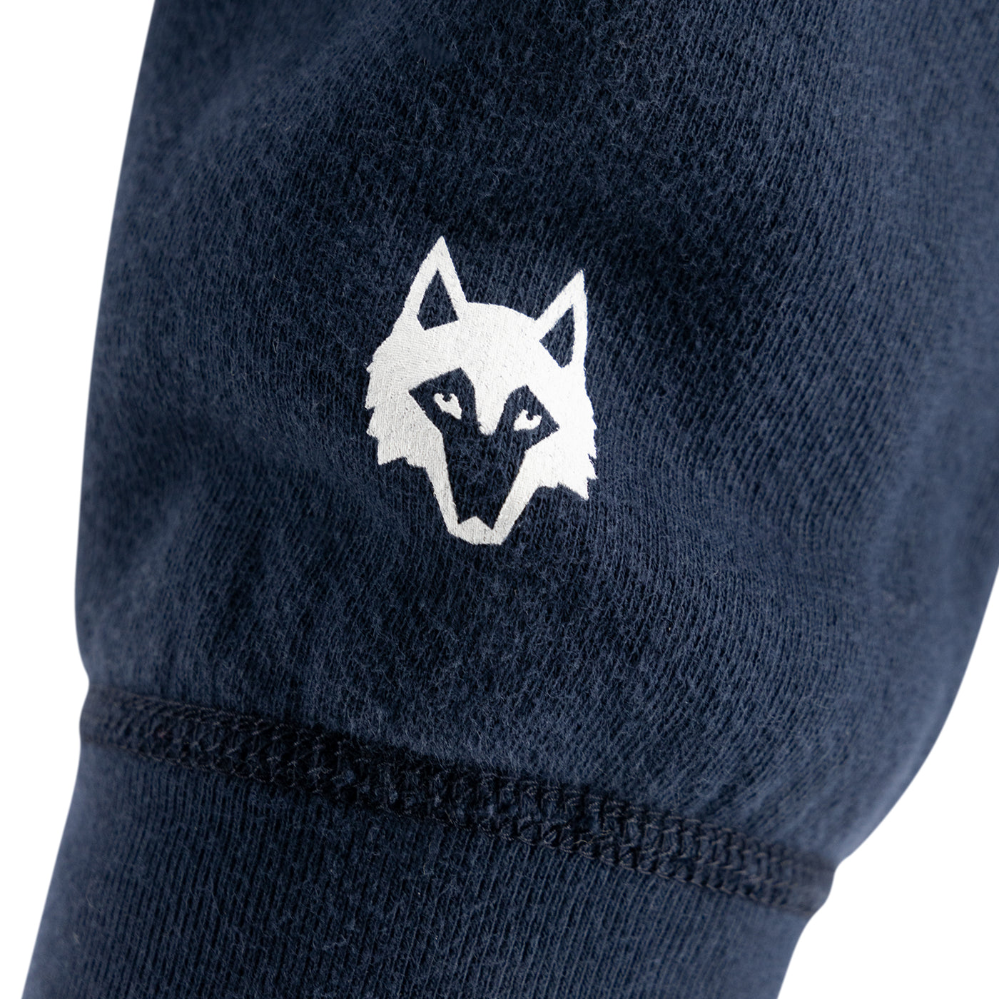greyson brand wolf on a navy blue sleeve