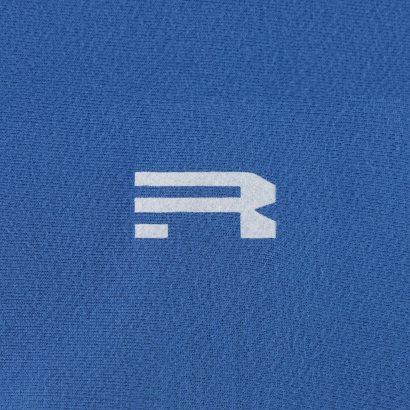 White logo on a blue textured background