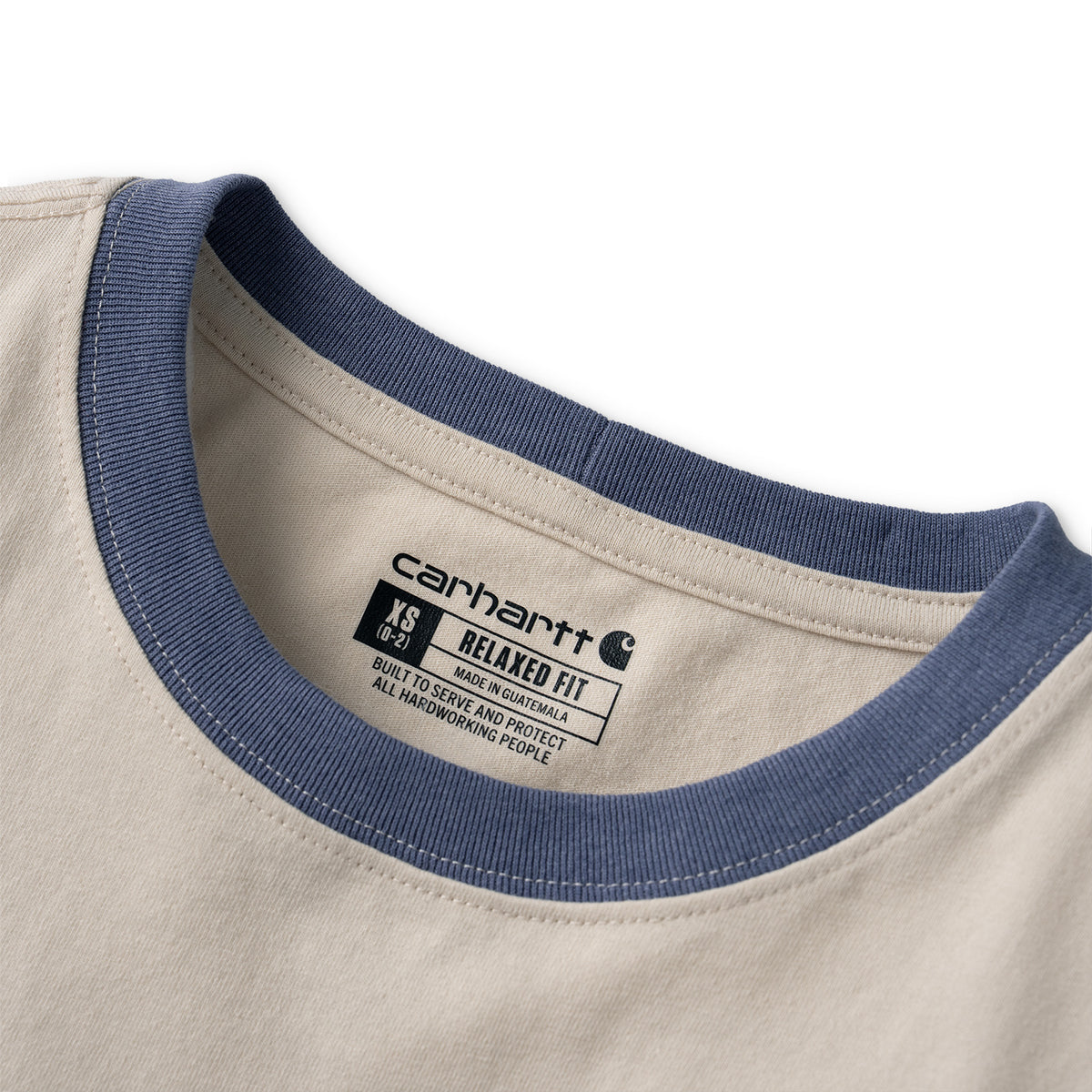 Close-up of a Carhartt t-shirt collar showing a navy blue ribbed ringer trim and a beige inner neck label with the Carhartt logo.