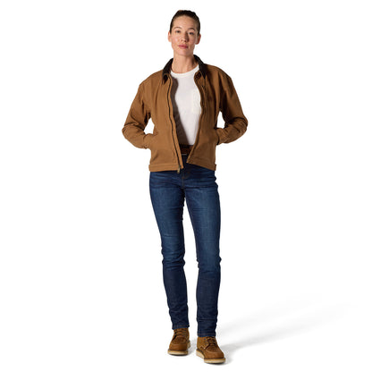 A woman modeling a brown zip-up jacket with dark collar lining, worn over a white t-shirt and blue jeans, standing against a plain white background.