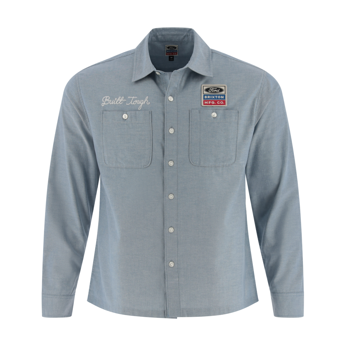 Light blue button-up shirt with embroidered text and patches on a white background