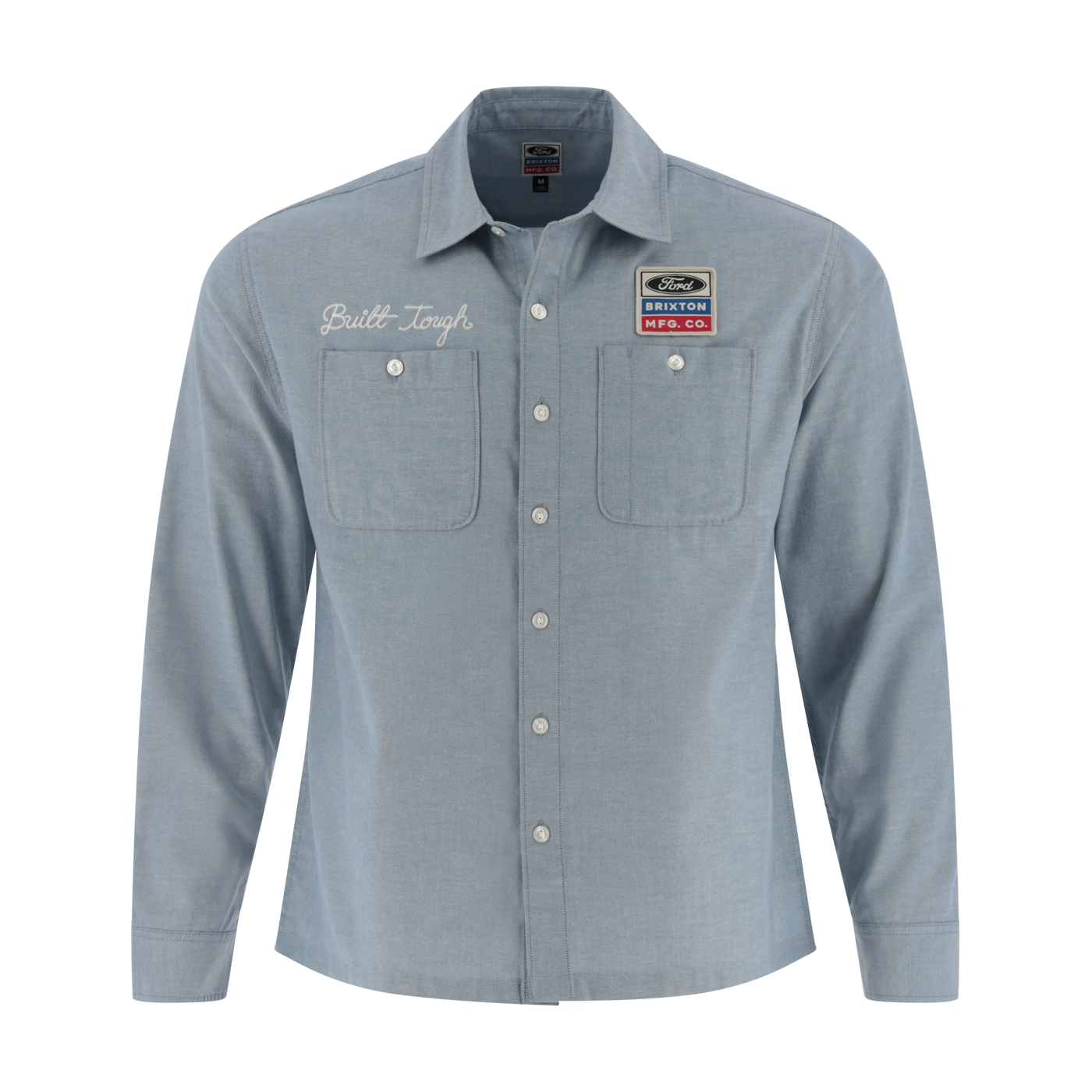Light blue button-up shirt with embroidered text and patches on a white background