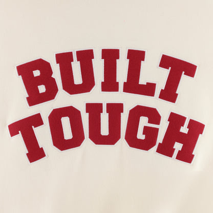 Red text 'BUILT TOUGH' on a beige background