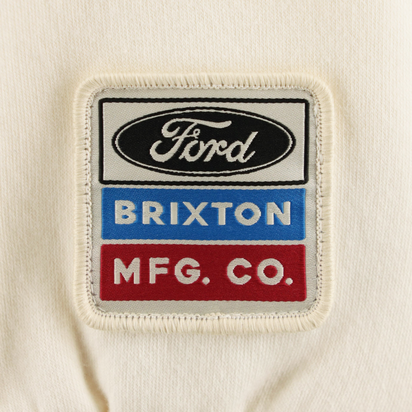 Patch with Ford, Brixton, and MFG. CO. logos on a beige background