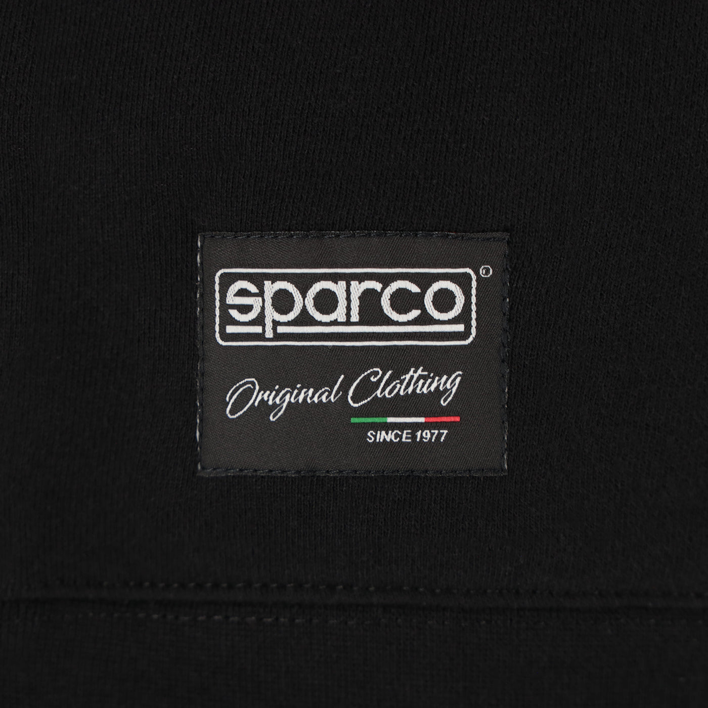 Black background with white text "Sparco" original clothing since 1977.