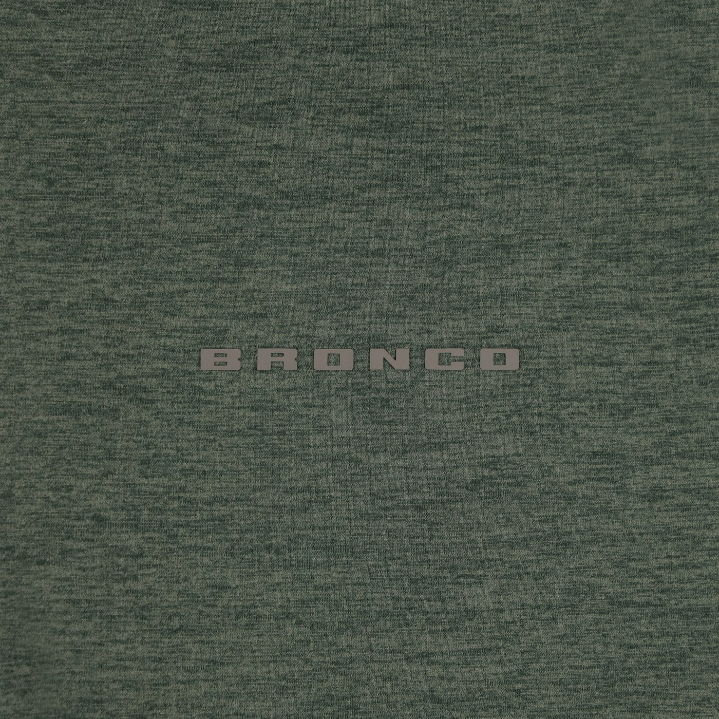 Textured green fabric with 'BRONCO' branding.