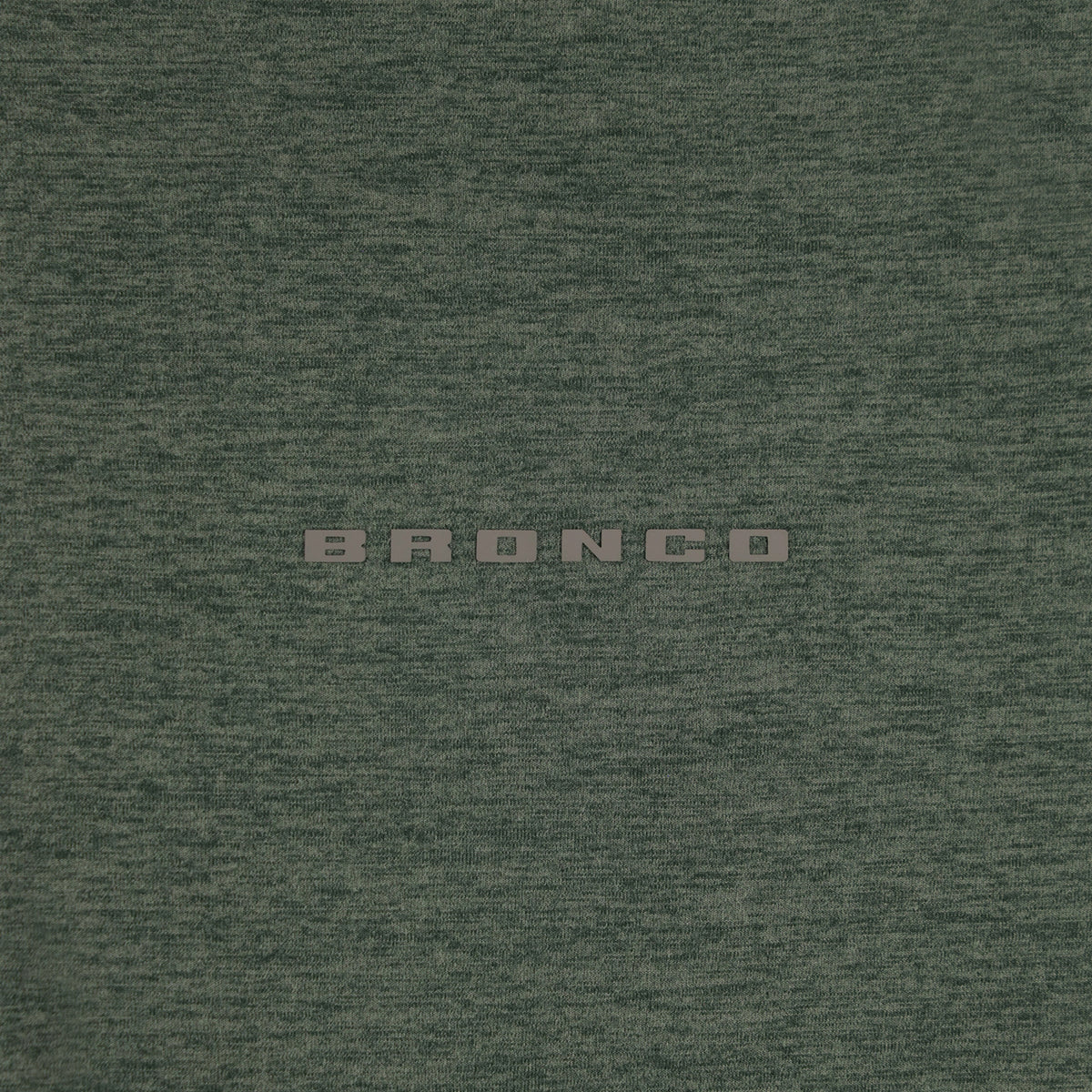 Textured green fabric with 'BRONCO' branding.