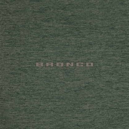 Textured green fabric with 'BRONCO' branding.