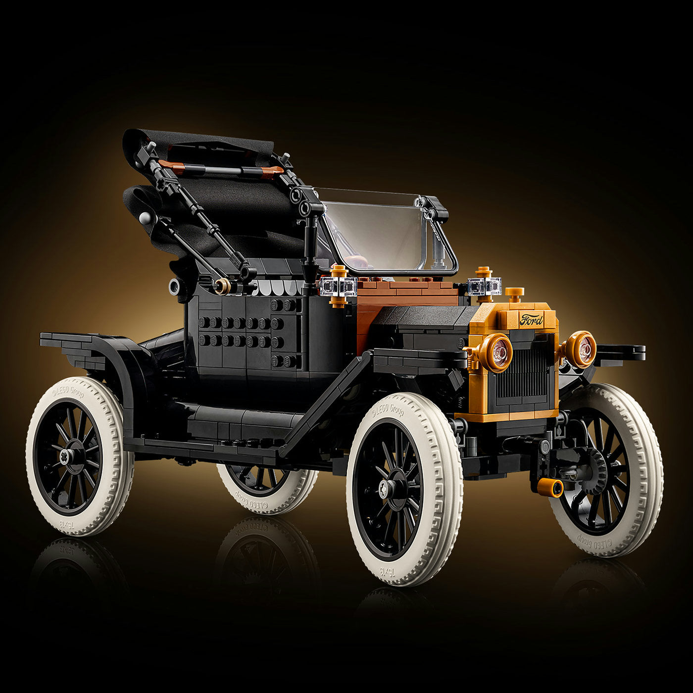Model of an old-fashioned car made from interlocking bricks on a dark background
