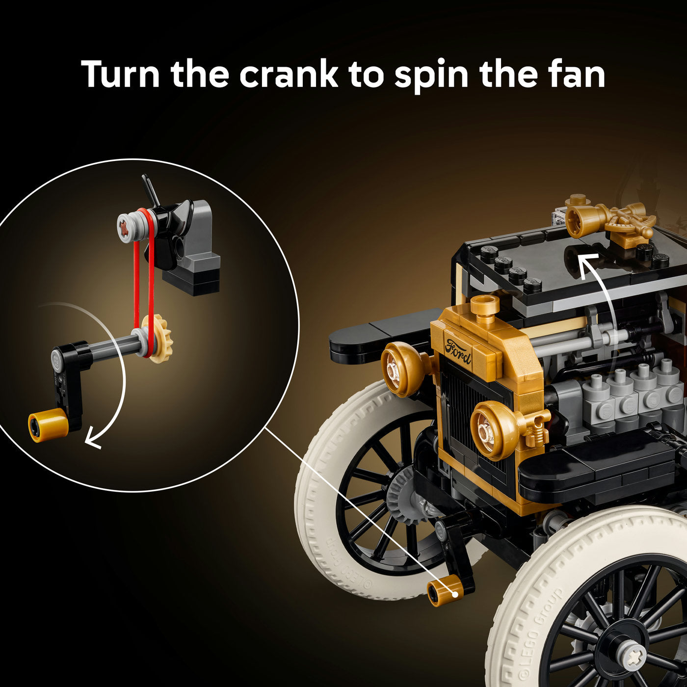 Toy car model with crank and fan mechanism on a dark background