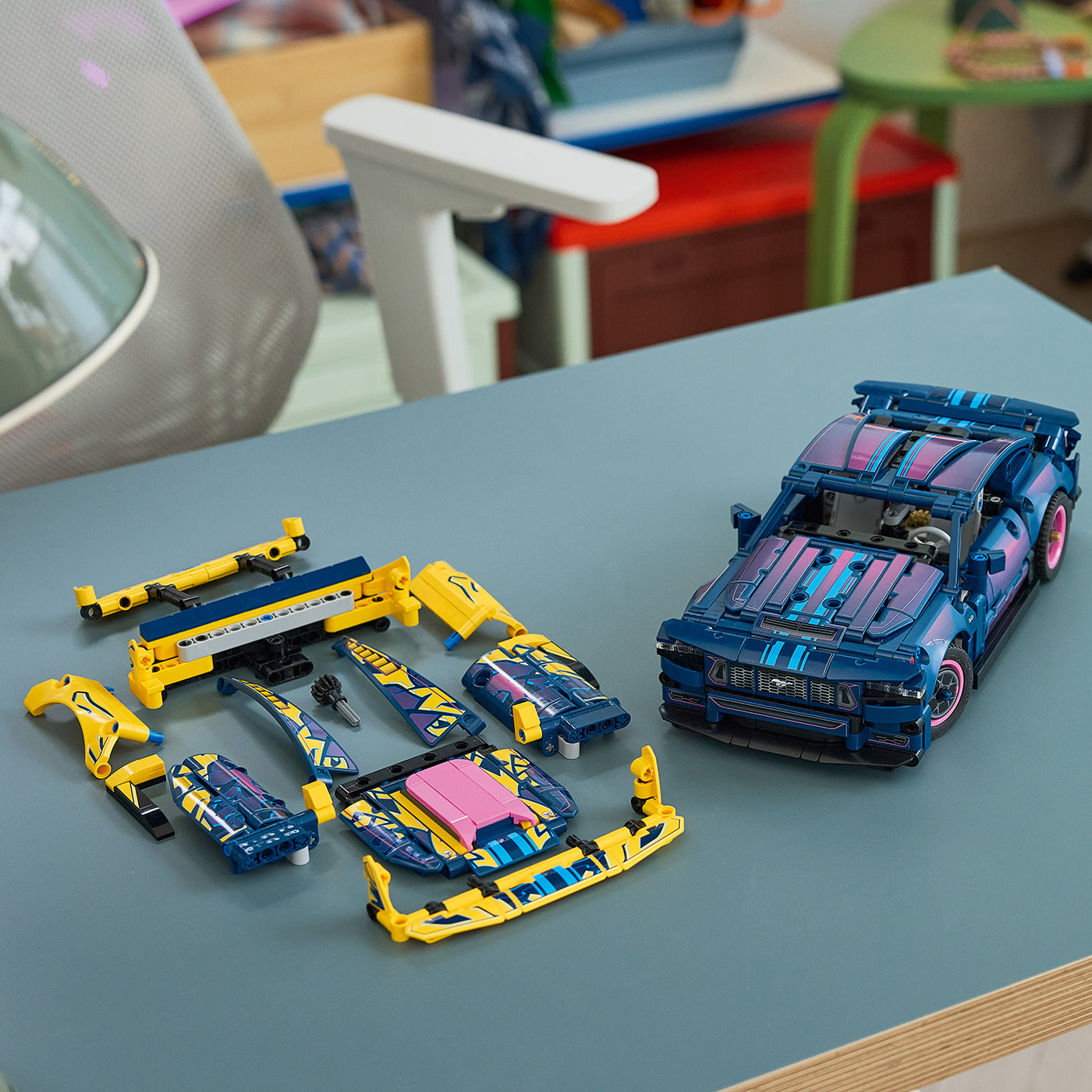 Toy car set with blue and yellow pieces on a table