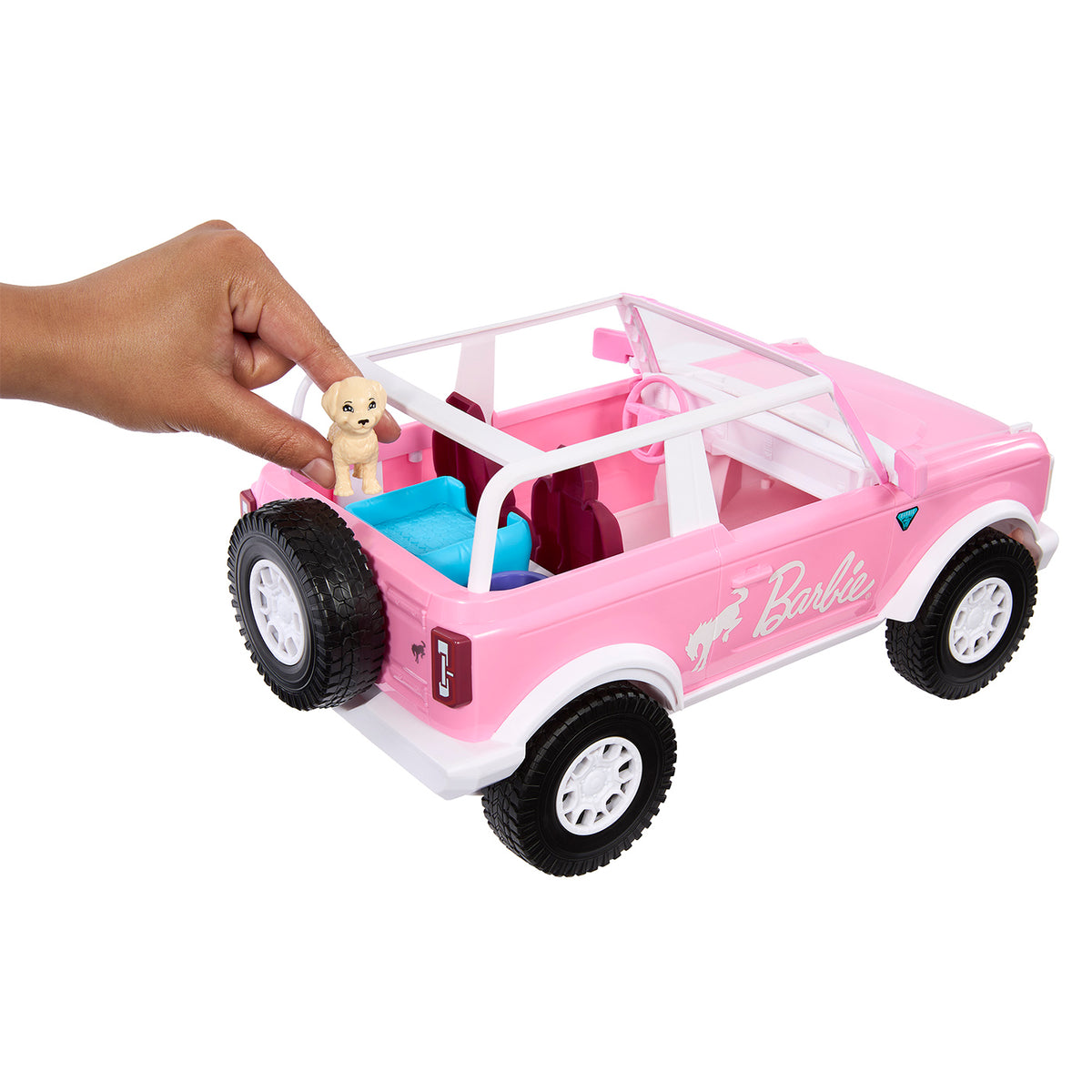 back of a Pink Barbie Bronco toy car with toy dog 