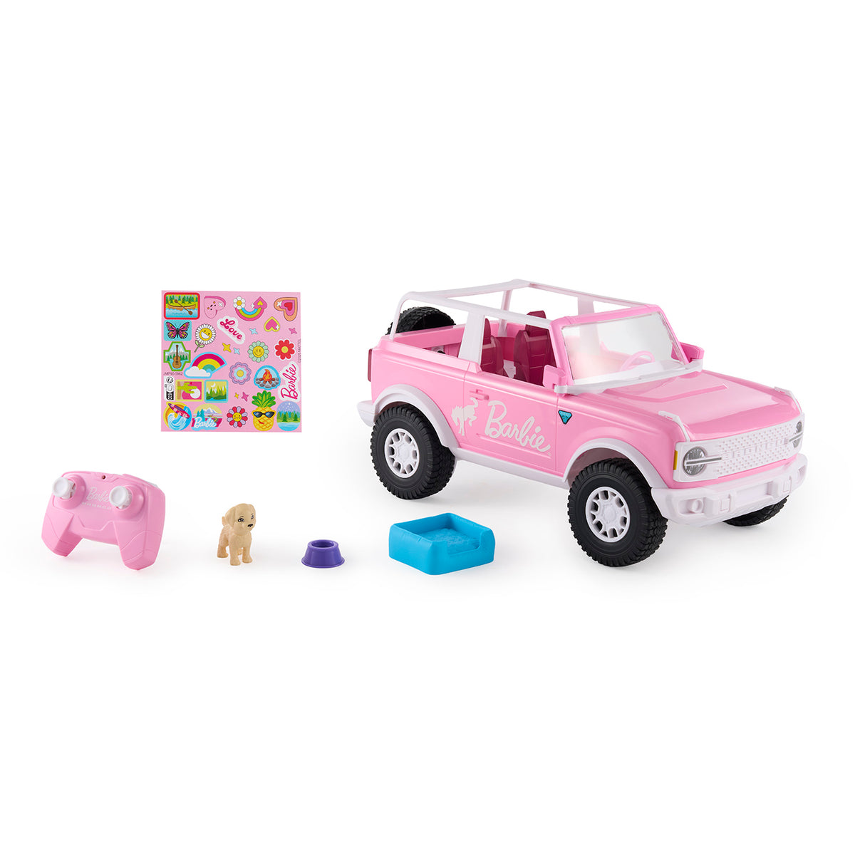 A pink Barbie-themed toy Bronco vehicle set on a white background, including a pink and white open-top SUV, a pink remote control, a small beige dog figure, a blue storage box, and a sticker sheet.